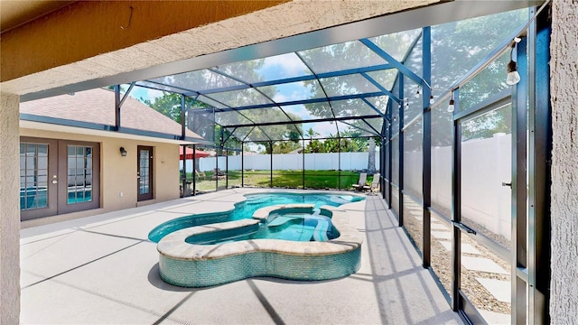 14723 Pine Cone Trl, Clermont, FL 34711 - view of swimming pool with french doors, a patio area, a pool with connected hot tub, and a lanai