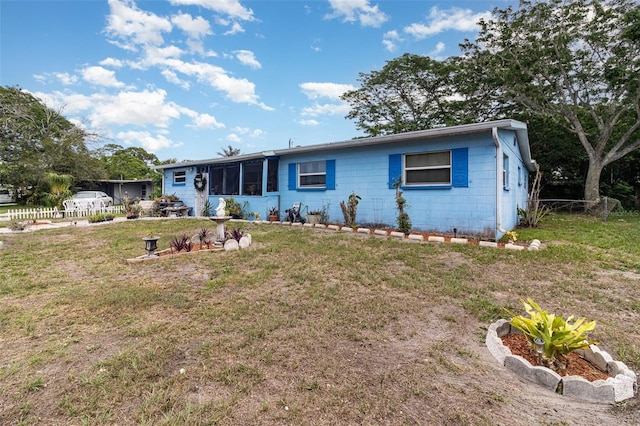 987 Alsup Dr, Rockledge, FL 32955 - view of front of home featuring a front yard and concrete block siding