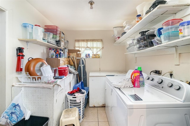 987 Alsup Dr, Rockledge, FL 32955 - laundry area featuring washer and clothes dryer and light tile patterned floors