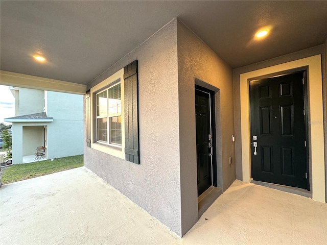 1147 Pomelo St, Davenport, FL 33837 - entrance to property featuring stucco siding