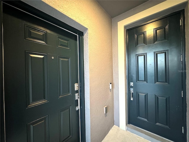 1147 Pomelo St, Davenport, FL 33837 - doorway to property featuring stucco siding