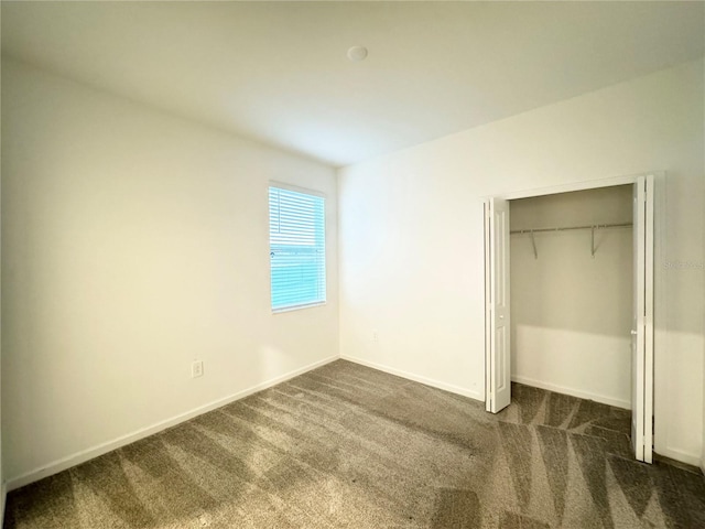 1147 Pomelo St, Davenport, FL 33837 - unfurnished bedroom featuring carpet flooring, baseboards, and a closet