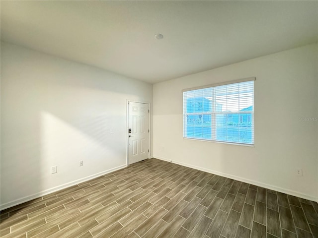 1147 Pomelo St, Davenport, FL 33837 - unfurnished room with wood finished floors and baseboards