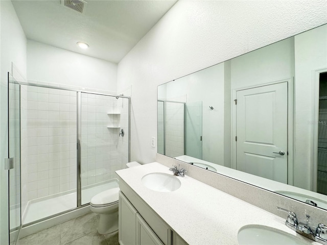 1147 Pomelo St, Davenport, FL 33837 - full bath with toilet, a stall shower, double vanity, and tile patterned floors