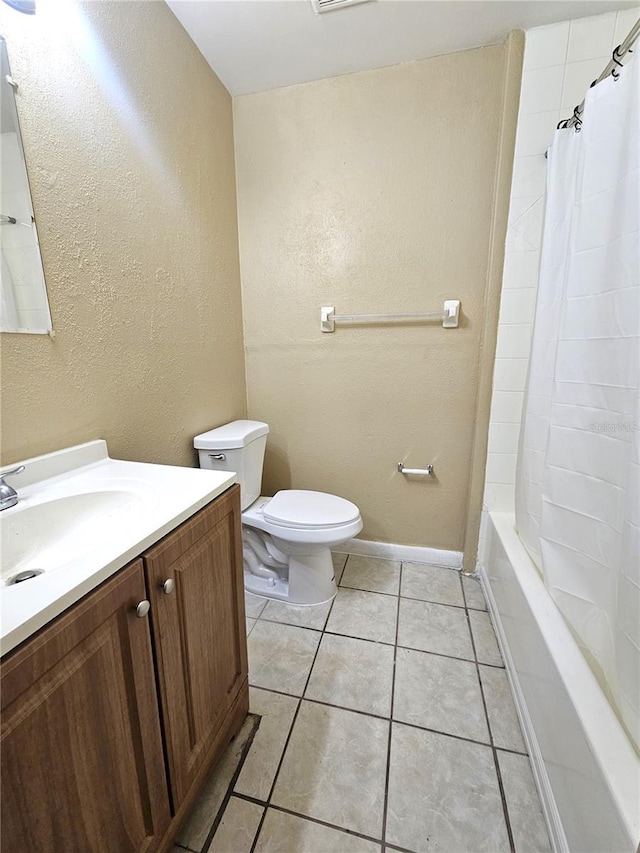 bathroom featuring vanity, toilet, tile patterned flooring, shower / bathtub combination with curtain, and a textured wall