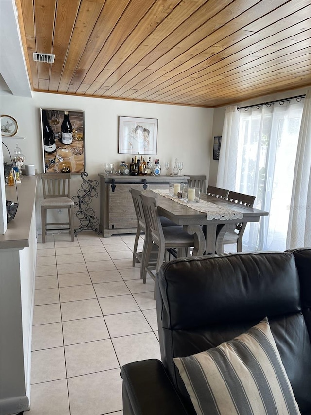1120 SE 6th Ter, Pompano Beach, FL 33060 - dining area featuring wood ceiling and light tile patterned flooring
