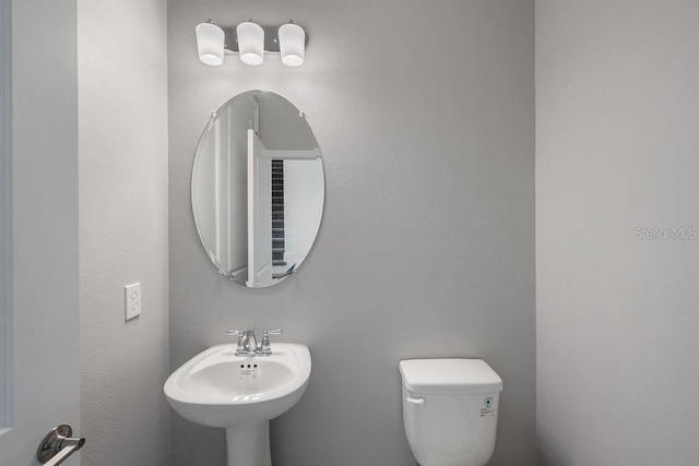 1551 Gateway Ln, Kissimmee, FL 34746 - bathroom featuring toilet and a sink