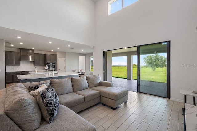 1551 Gateway Ln, Kissimmee, FL 34746 - living room featuring recessed lighting and a towering ceiling