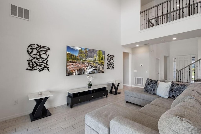 1551 Gateway Ln, Kissimmee, FL 34746 - living room featuring wood tiled floors and a high ceiling