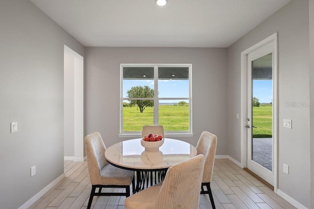 1551 Gateway Ln, Kissimmee, FL 34746 - dining room with light wood-style floors