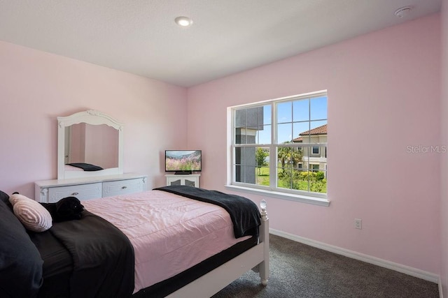 1551 Gateway Ln, Kissimmee, FL 34746 - carpeted bedroom featuring baseboards