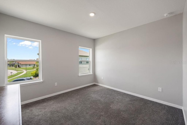 1551 Gateway Ln, Kissimmee, FL 34746 - unfurnished room featuring baseboards and dark carpet