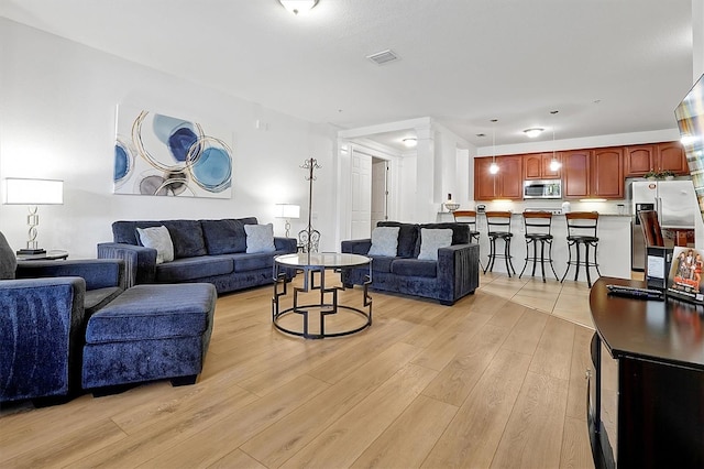 5024 Shoreway Loop Unit 10106, Orlando, FL 32819 - living area with light wood-style floors