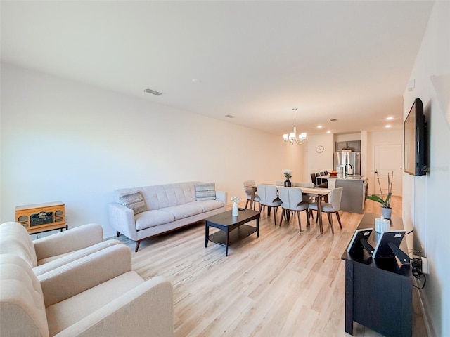 1471 Mirabella Cir, Davenport, FL 33897 - living room with a chandelier, light wood-style flooring, and recessed lighting