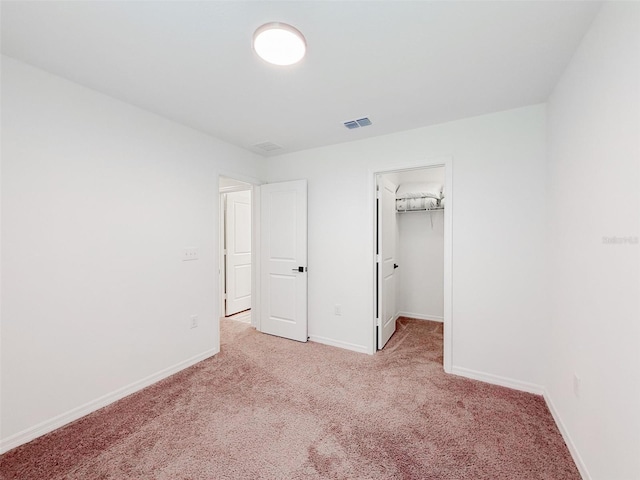 1471 Mirabella Cir, Davenport, FL 33897 - unfurnished bedroom featuring carpet floors, baseboards, and a spacious closet