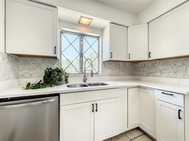 249 Spartan Dr, Maitland, FL 32751 - kitchen with stainless steel dishwasher, white cabinetry, light countertops, and light tile patterned floors