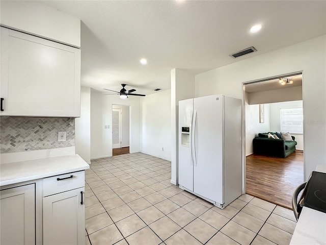 249 Spartan Dr, Maitland, FL 32751 - kitchen with white refrigerator with ice dispenser, light countertops, a ceiling fan, tasteful backsplash, and light tile patterned floors