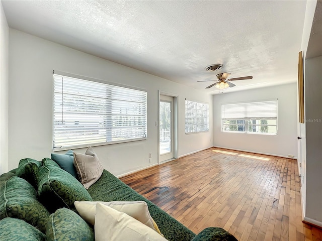 249 Spartan Dr, Maitland, FL 32751 - living area featuring hardwood / wood-style floors, a ceiling fan, and a textured ceiling