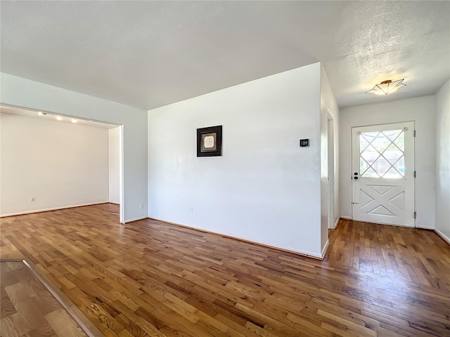 249 Spartan Dr, Maitland, FL 32751 - empty room with hardwood / wood-style floors and a textured ceiling