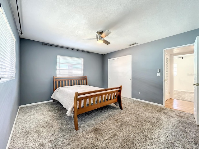 249 Spartan Dr, Maitland, FL 32751 - carpeted bedroom with a textured ceiling, ceiling fan, and a closet