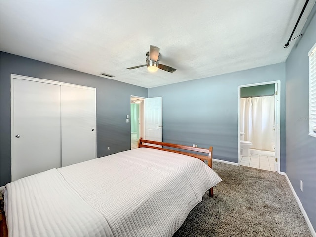 249 Spartan Dr, Maitland, FL 32751 - carpeted bedroom featuring a closet, a ceiling fan, and connected bathroom