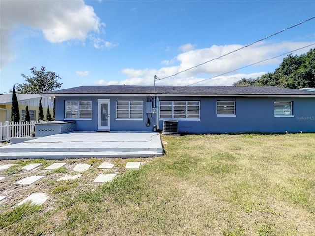249 Spartan Dr, Maitland, FL 32751 - back of property with a shingled roof and a patio area