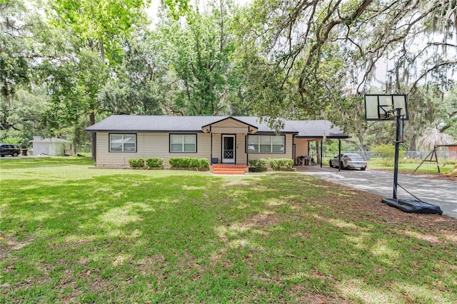 1753 NW 44th St, Ocala, FL 34475 - ranch-style house featuring driveway, a front lawn, and a carport
