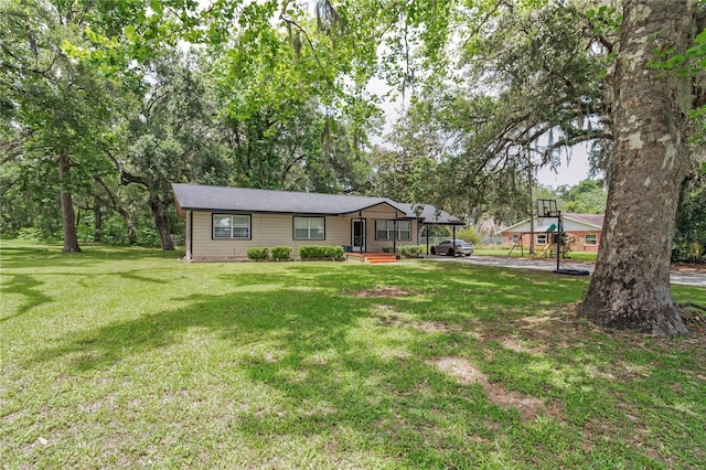1753 NW 44th St, Ocala, FL 34475 - single story home featuring a front lawn, a carport, and view of scattered trees