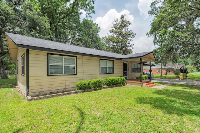 1753 NW 44th St, Ocala, FL 34475 - view of front of home featuring covered porch and a front lawn