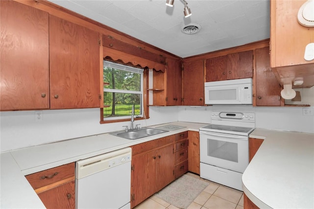 1753 NW 44th St, Ocala, FL 34475 - kitchen featuring white appliances, a sink, light countertops, and light tile patterned floors