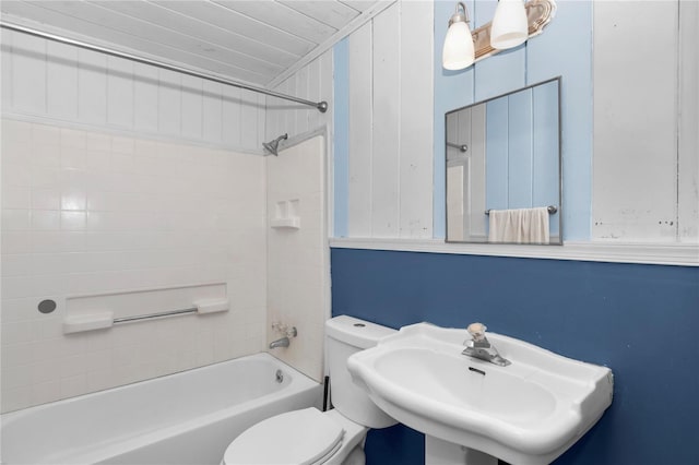 1753 NW 44th St, Ocala, FL 34475 - bathroom featuring a sink, toilet, and washtub / shower combination