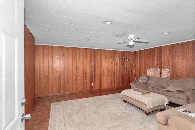 1753 NW 44th St, Ocala, FL 34475 - living room featuring a ceiling fan, wood finished floors, wooden walls, and baseboards