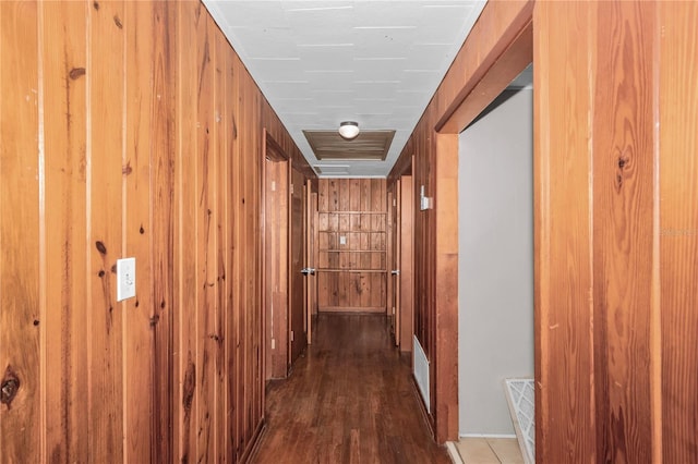 1753 NW 44th St, Ocala, FL 34475 - hallway featuring wood finished floors, wood walls, and baseboards