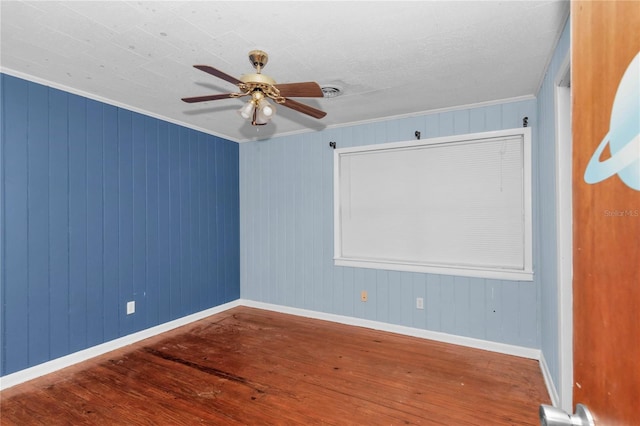 1753 NW 44th St, Ocala, FL 34475 - unfurnished room featuring wood-type flooring, crown molding, ceiling fan, and baseboards