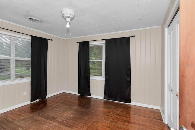 1753 NW 44th St, Ocala, FL 34475 - spare room featuring crown molding, wood finished floors, and baseboards