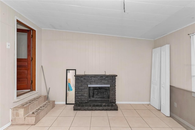 1753 NW 44th St, Ocala, FL 34475 - unfurnished living room with light tile patterned floors, a brick fireplace, wood walls, and ornamental molding