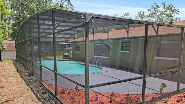 2804 Clearfield Ave, Orlando, FL 32808 - back of property with an outdoor pool, a patio, and a lanai