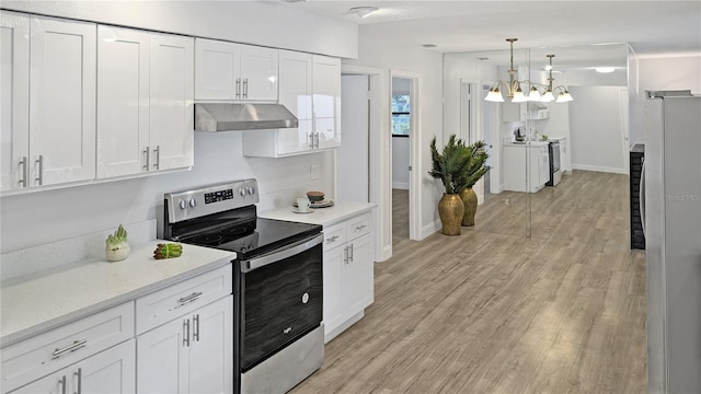 2804 Clearfield Ave, Orlando, FL 32808 - kitchen featuring stainless steel appliances, under cabinet range hood, white cabinetry, and light wood-style flooring