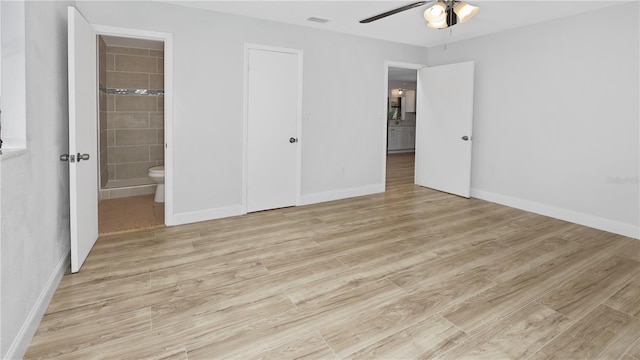 2804 Clearfield Ave, Orlando, FL 32808 - unfurnished bedroom featuring light wood-type flooring, ensuite bathroom, and ceiling fan