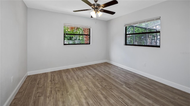 2804 Clearfield Ave, Orlando, FL 32808 - empty room with wood finished floors and a ceiling fan