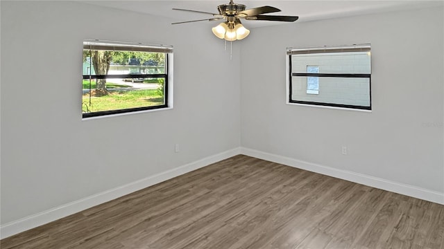 2804 Clearfield Ave, Orlando, FL 32808 - empty room with wood finished floors and a ceiling fan