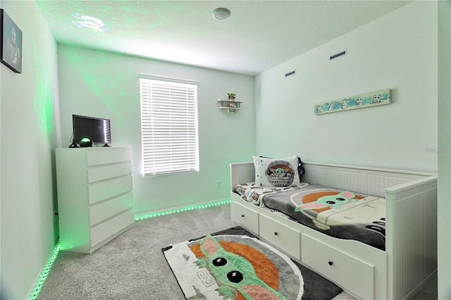 832 Longboat Dr, Davenport, FL 33896 - bedroom featuring light colored carpet, multiple windows, and a textured ceiling