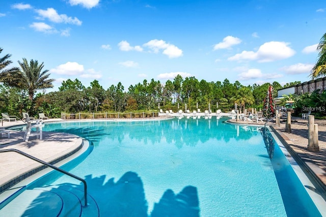 832 Longboat Dr, Davenport, FL 33896 - community pool featuring a patio