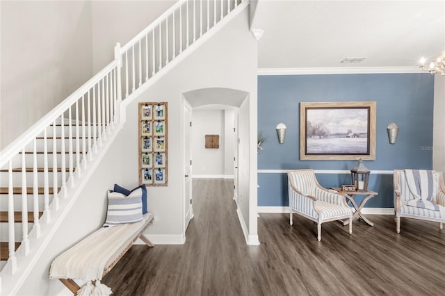 25537 High Hampton Cir, Sorrento, FL 32776 - foyer entrance featuring arched walkways, wood finished floors, baseboards, stairs, and ornamental molding
