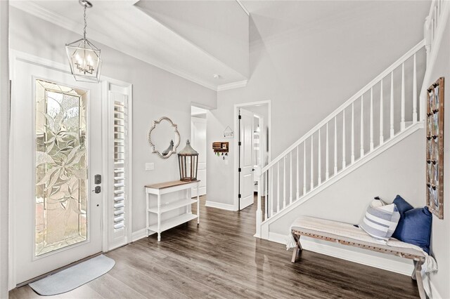 25537 High Hampton Cir, Sorrento, FL 32776 - foyer featuring a chandelier, stairs, ornamental molding, wood finished floors, and baseboards