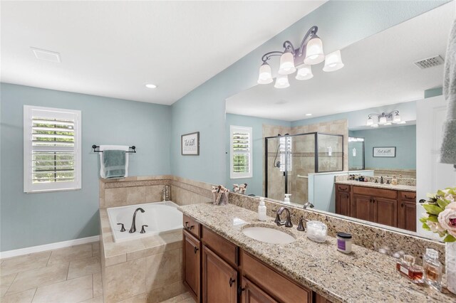 25537 High Hampton Cir, Sorrento, FL 32776 - bathroom with healthy amount of natural light, a shower stall, a garden tub, and two vanities