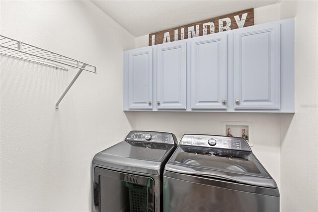 25537 High Hampton Cir, Sorrento, FL 32776 - washroom with cabinet space and washer and dryer