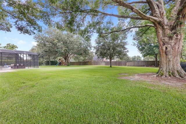 25537 High Hampton Cir, Sorrento, FL 32776 - view of yard featuring a playground and glass enclosure