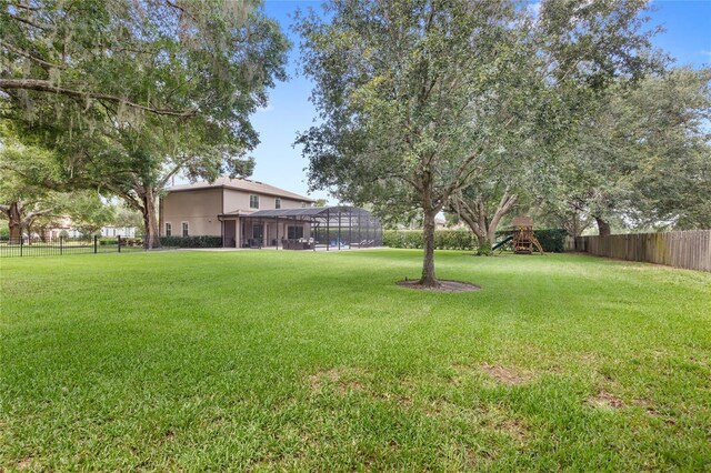 25537 High Hampton Cir, Sorrento, FL 32776 - view of yard with a playground and glass enclosure