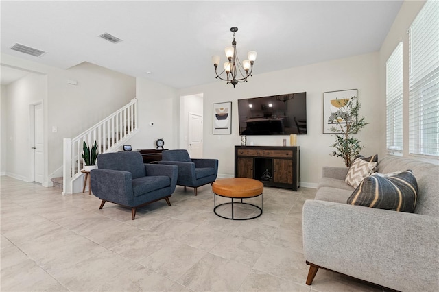 2279 Mountain Pine St, Ocoee, FL 34761 - living room with stairs, healthy amount of natural light, a chandelier, and light tile patterned floors
